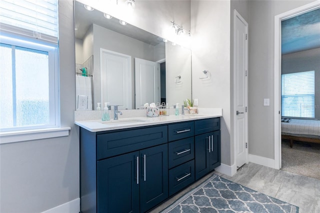 bathroom with a shower and vanity