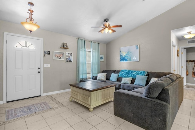 living room with light tile patterned flooring, vaulted ceiling, and ceiling fan