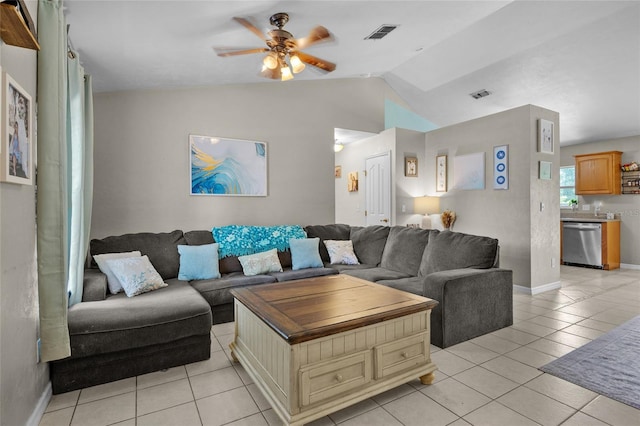 tiled living room with lofted ceiling and ceiling fan