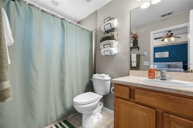 bathroom with vanity, toilet, tile patterned floors, and ceiling fan