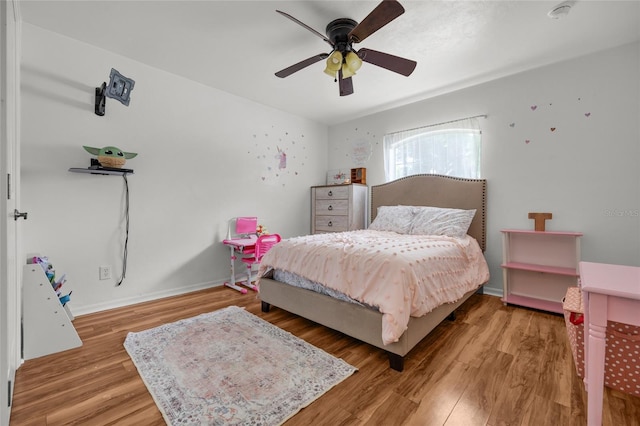 bedroom featuring wood-type flooring and ceiling fan