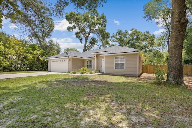 ranch-style home with a garage and a front lawn