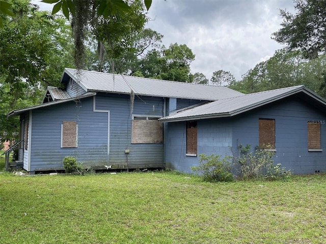 view of home's exterior featuring a yard