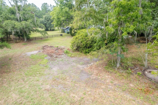 view of yard with a rural view