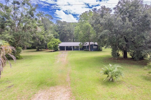 view of yard with a carport