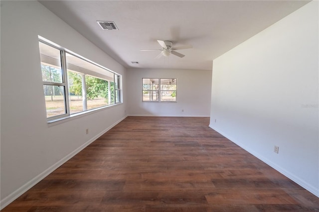 unfurnished room featuring dark hardwood / wood-style flooring and ceiling fan