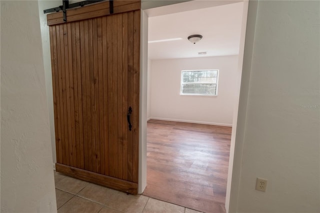 hallway with light tile patterned flooring