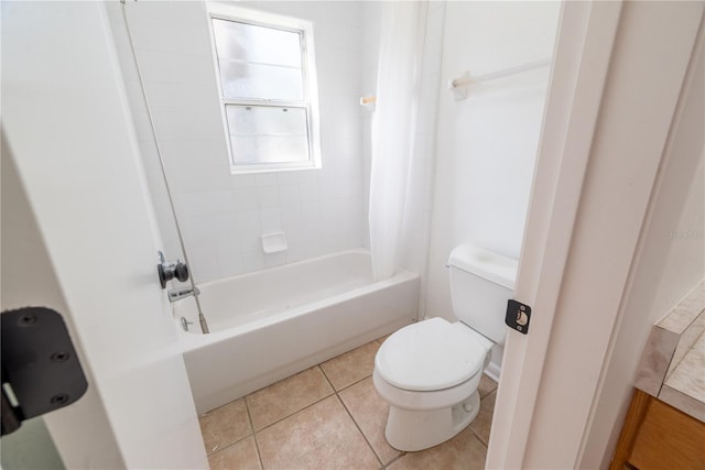 bathroom with tile patterned floors, toilet, and shower / tub combo