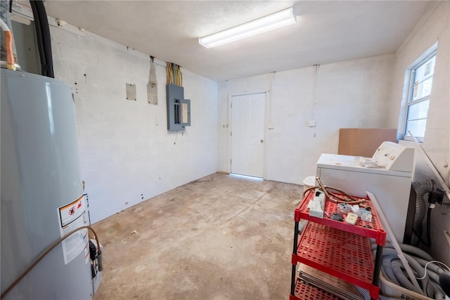 basement featuring washer / dryer, electric panel, and water heater