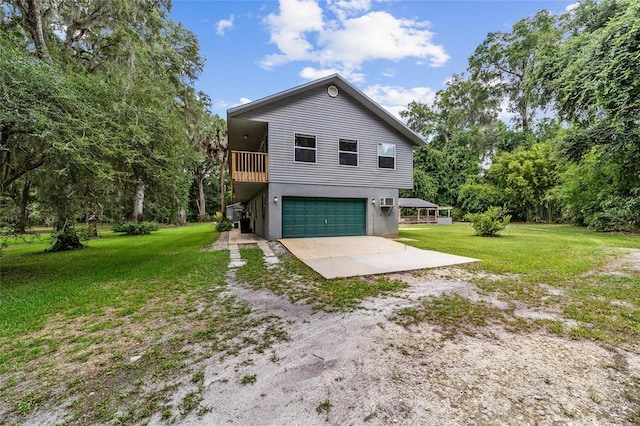 view of front facade with a front yard and a garage