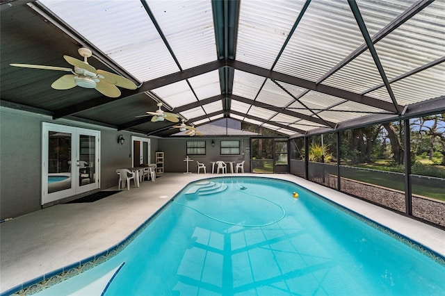 view of pool featuring a lanai, a patio area, ceiling fan, and french doors