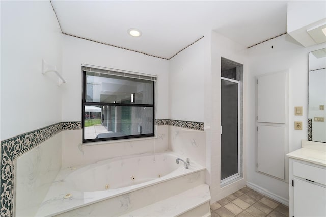 bathroom featuring tile patterned flooring, vanity, and separate shower and tub