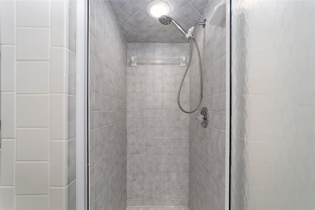 bathroom with a tile shower