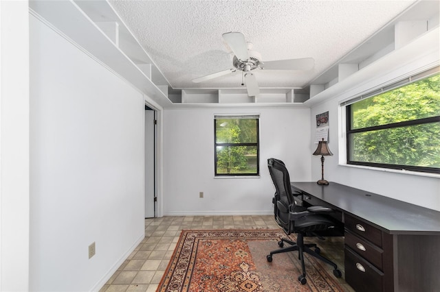 office area featuring ceiling fan and a textured ceiling