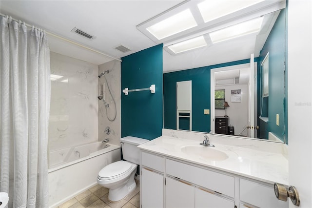 full bathroom featuring tile patterned flooring, vanity, toilet, and shower / tub combo