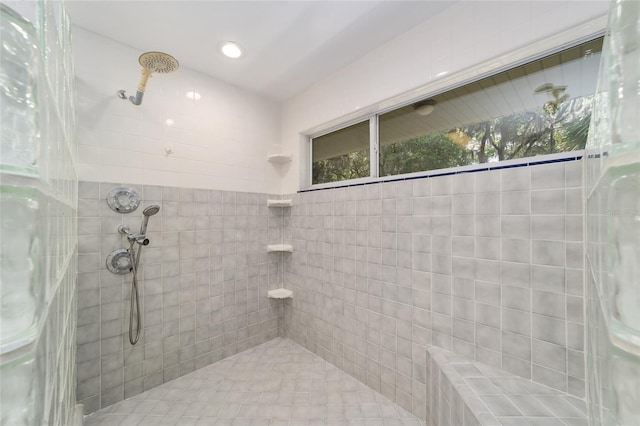 bathroom with a tile shower