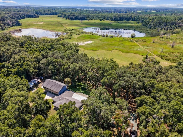 birds eye view of property with a rural view and a water view