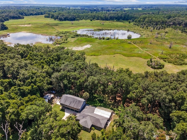 drone / aerial view featuring a water view and a rural view