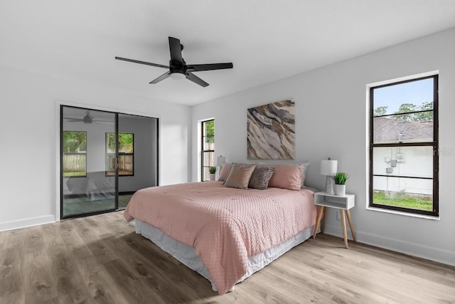 bedroom with ceiling fan, access to exterior, and light hardwood / wood-style floors