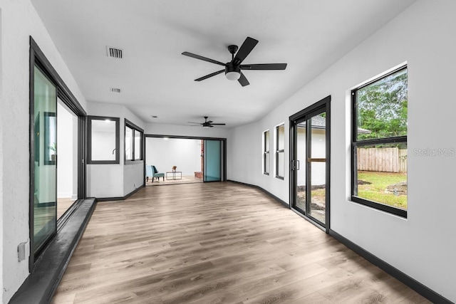 spare room with wood-type flooring