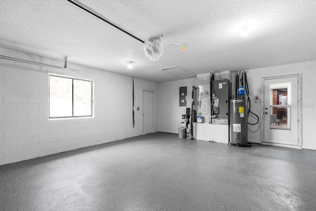 garage featuring water heater, heating unit, and electric panel