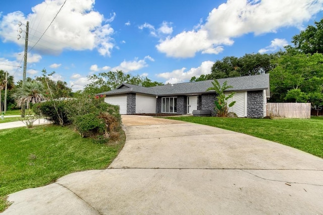 ranch-style house with a garage and a front yard