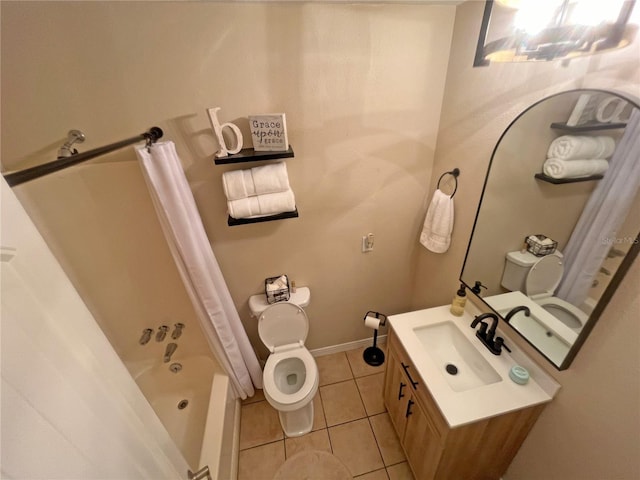 full bathroom featuring tile patterned flooring, toilet, vanity, and shower / bath combo with shower curtain