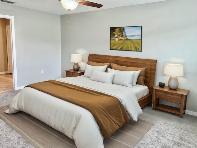 bedroom with light carpet and ceiling fan