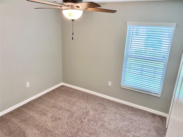 unfurnished room with carpet floors and ceiling fan