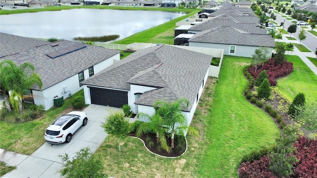 bird's eye view with a water view