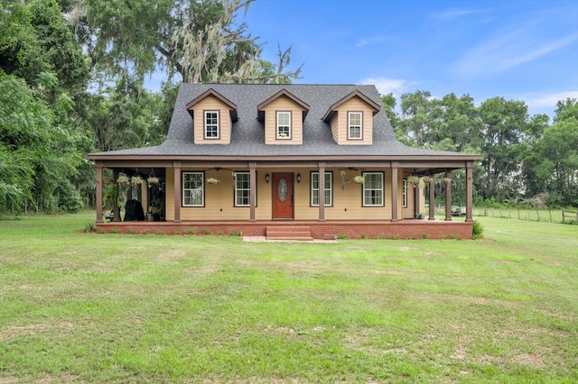 farmhouse-style home with covered porch and a front yard