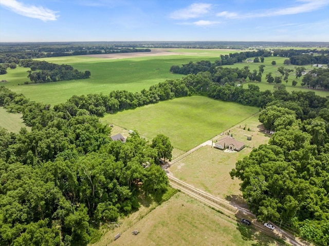 birds eye view of property featuring a rural view