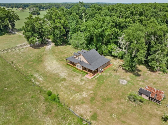 birds eye view of property with a rural view