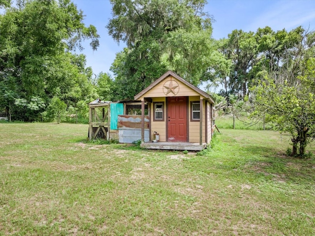 view of outdoor structure with a lawn