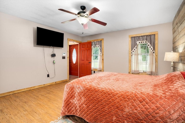 bedroom featuring ceiling fan and light wood-type flooring