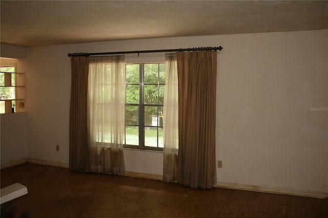 spare room featuring a wealth of natural light