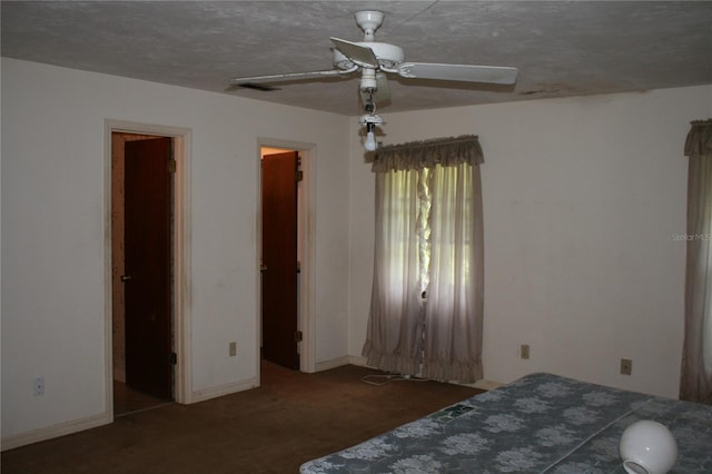 unfurnished bedroom featuring carpet floors and ceiling fan