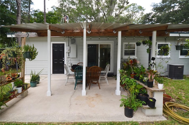 view of patio with central AC unit and a pergola