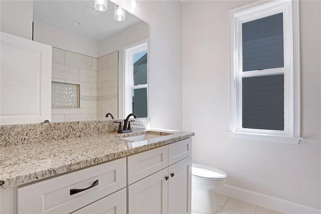 full bathroom featuring baseboards, vanity, toilet, and tile patterned floors