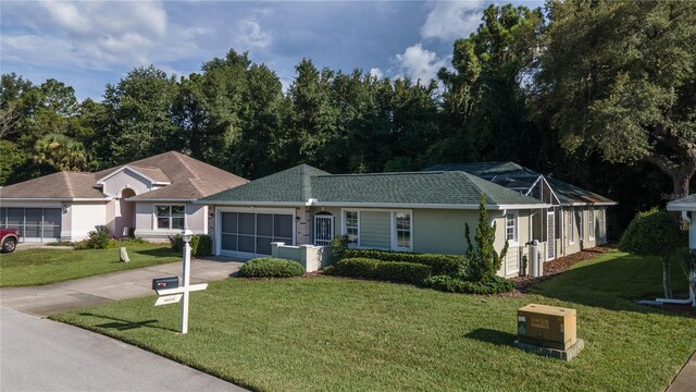 ranch-style house with a garage and a front yard