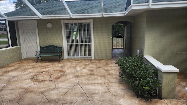 doorway to property with a patio