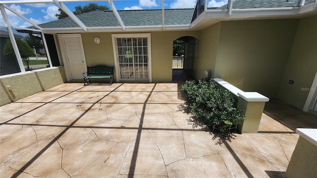 view of patio with a lanai