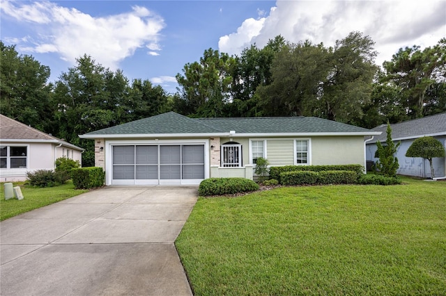 ranch-style house with a garage and a front lawn