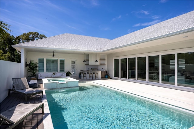 view of swimming pool featuring an in ground hot tub, a patio, and ceiling fan