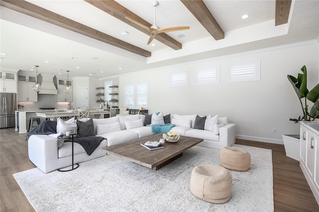 living room featuring light hardwood / wood-style flooring, ornamental molding, and ceiling fan