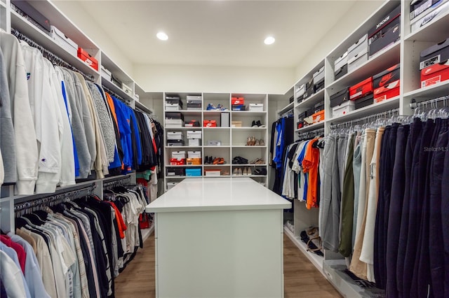 spacious closet featuring hardwood / wood-style floors