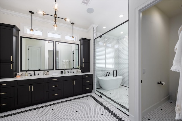 bathroom with dual vanity, tile patterned flooring, ornamental molding, and tile walls