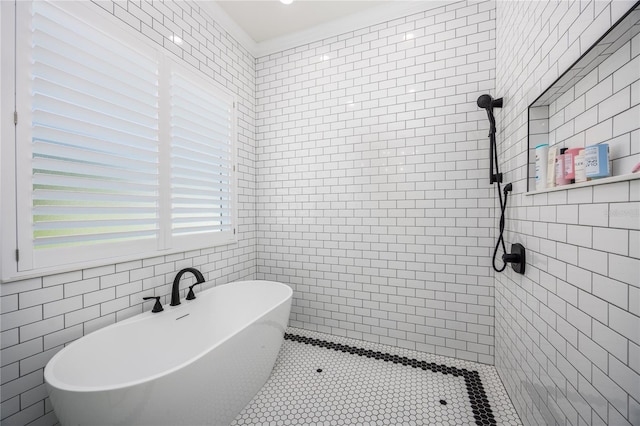 bathroom with tile walls and independent shower and bath