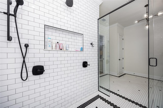 bathroom with tile patterned floors, a shower with shower door, and ornamental molding