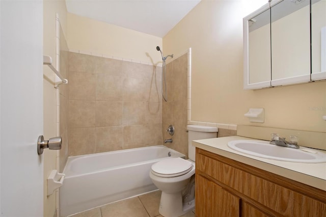 full bathroom featuring tiled shower / bath combo, vanity, tile patterned floors, and toilet